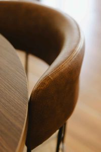 Leather Furniture: Enduring Luxury for Elevated Living 5 full-service-interior-design-bald-head-island-nc-luxury-leather-furniture-leather-chair-back-at-table-craftsmanship-online-interior-design